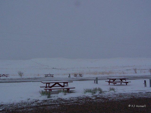 100_1128_MT_Shelby_Snowstorm.jpg - Almost stopped snowing so we decided to move on North... on our trip to Alaska. ~May 12, 2004 - Shelby, Montana