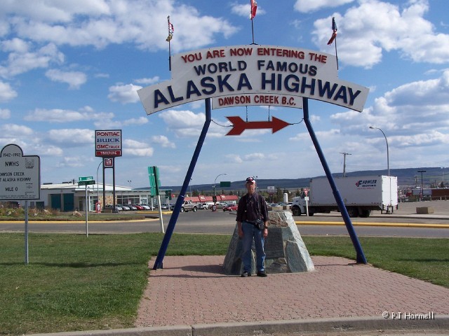 100_1136_BC_AlaskaHwy_Mile0Cairn.jpg - Alaska Highway - Jon at the Mile 0 cairn in Dawson Creek where we begin our journey on the Alaska Highway. ~May 16, 2004 - British Columbia