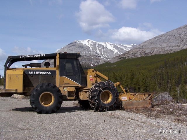 100_1167_BC_AlaskaHwy_HeavyEquip.jpg - You know the weather gets bad when you find heavy equipment  parked in a turnout... chains included. ~May 19, 2004, Mile Marker 372, Alaska Highway - British Columbia