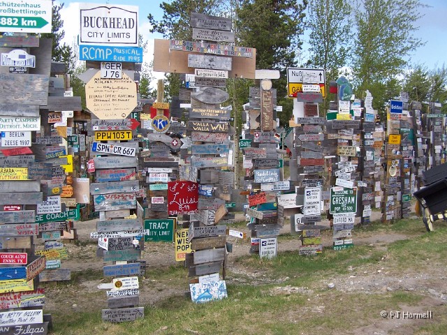 100_1286_YT_AlaskaHwy_SignForest.jpg - Watson Lake Sign Forest -The signs added by travelers numbered more than 49,800 in 2002 according to "The Mile Post", a guide book. ~May 20, 2004, Mile Marker 612, Alaska Highway - Yukon Territory