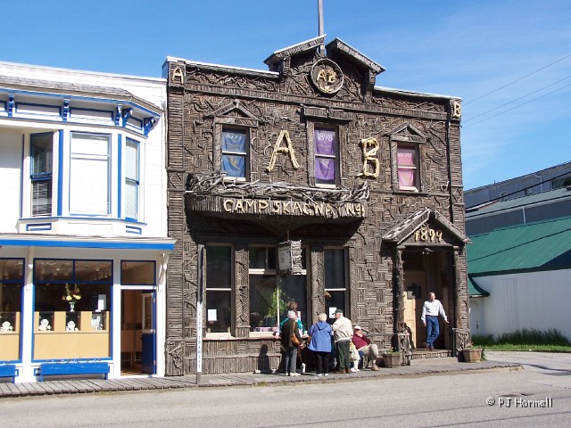 100_1413_AK_Skagway_Downtown.jpg - The Artic Brotherhood Hall building is covered with 8,833 sticks of driftwood. This building now serves as a visitor center  for Skagway.  ~May 23, 2004 - Skagway, Alaska
