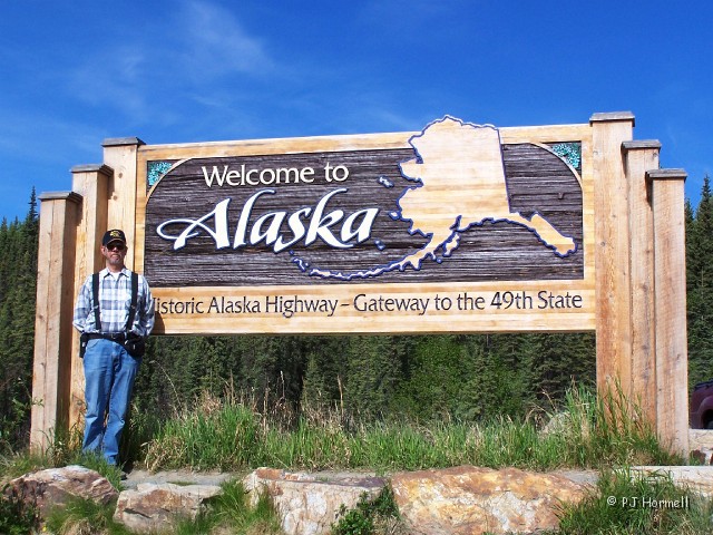 100_1668__AK_AlaskaHwy_WelcomeSign.jpg - Welcome to Alaska Jon.  Arriving at Alaska... and crossing another border. ~June 1, 2004, Alaska, Mile Marker 1221, Alaska Highway - Alaska