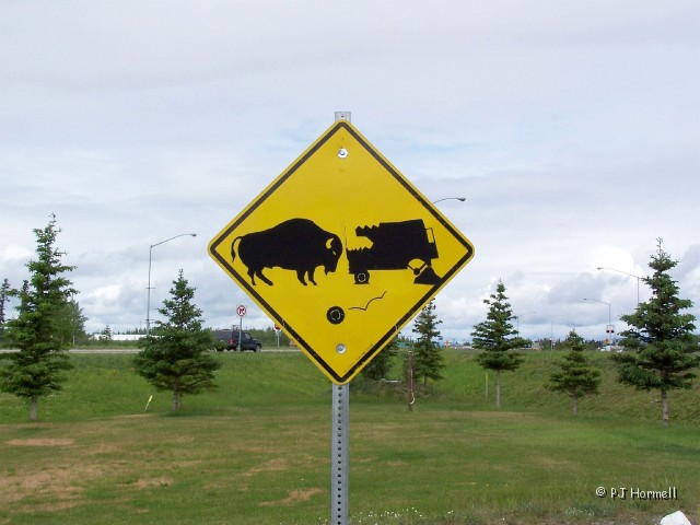 100_1713_AK_AlaskaHwy_Sign.jpg - Humorous sign at the visitor center in Delta Junction. ~June 3, 2004, Alaska, Mile Marker 1422, Alaska Highway - Delta Junction, Alaska