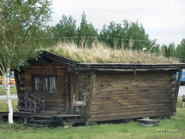100_1722_AK_AlaskaHwy_SodRoof.jpg - Sod Roofed Cabin - This cabin is located at the visitor center. Later on we saw other sod roofed cabins. ~June 3, 2004, Mile Marker 1422, Alaska Highway - Delta Junction, Alaska