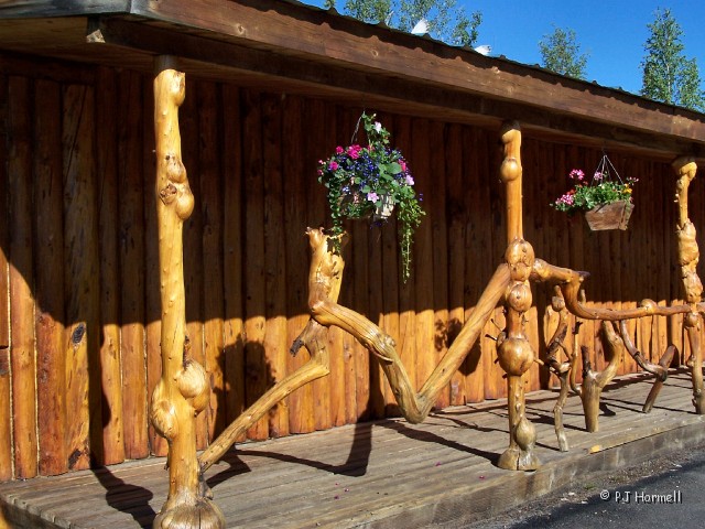 100_1904_AK_RichardsonHwy_KnottyShop.jpg - Knotty Shop - Porch rails made of burls. The burls (bumps or knots) are  found on Alaska spruce trees. The gift shop has many items made from the burls. ~June 4, 2004 - Mile Marker 332, Richardson Highway - Alaska