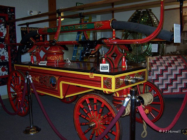 100_2061_AK_Valdez_FireEngine.jpg - 1886 Gleason & Bailey Handpumped Fire Engine - Besides the fire engines the museum also had interesting pieces of history from the gold mining era and quilts.  ~June 10, 2004 - Valdez, Alaska