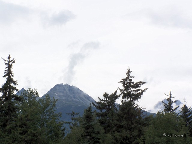 100_3598_AK_HainesHwy_Cloud.jpg - Cloud or Volcano? One day I noticed a cloud hanging out over this mountain top and it looked as if the mountain was smoking. Grabbed the camera and snapped a quick shot. ~July 23, 2004 - Haines, Alaska