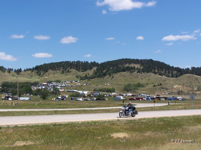 100_3994_SD_Sturgis_MotorcycleRally.jpg - Sturgis during Motorcycle week. The hillsides are covered with campers. This area is not as congested as others. ~August 11, 2004 - Sturgis, South Dakota