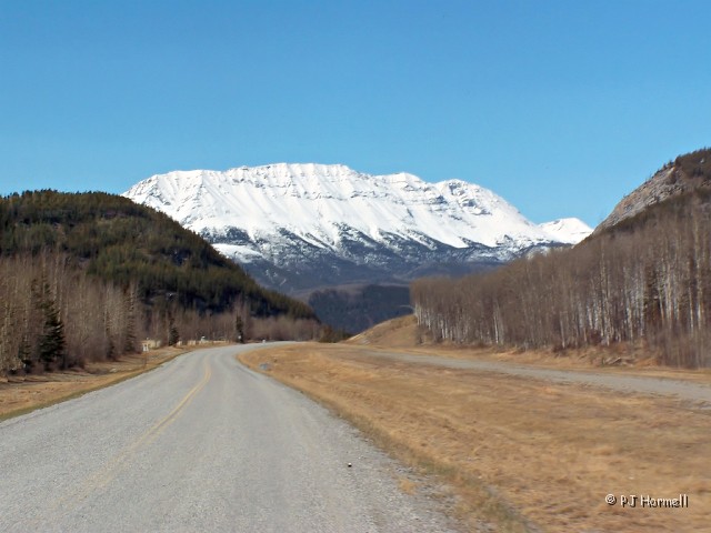 100_8163_BC_AlaskaHwy_Mountains.JPG - The snow melted fairly fast as the weather really warmed up quick. Northern Canadian Rocky Mountains -  near Milepost 428, Alaska Highway, British Columbia, Canada. ~May 15, 2006