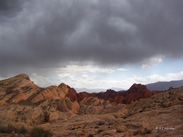 100_4823_NV_ValleyOfFire_FireValley.jpg - Storm Clouds Over Valley Of Fire - Yes, we did get some rain, but not much.  Valley of Fire State Park, Nevada ~May 10, 2005